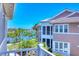 A scenic balcony view overlooking lush landscaping and a tranquil lake at 262 Sapphire Lake Dr # 202, Bradenton, FL 34209