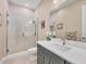 Stunning bathroom with frameless shower, modern vanity with a white countertop, and updated fixtures at 262 Sapphire Lake Dr # 202, Bradenton, FL 34209