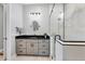 Updated ensuite bathroom with a glass enclosed shower, modern cabinets and updated fixtures at 262 Sapphire Lake Dr # 202, Bradenton, FL 34209