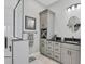 Updated ensuite bathroom with a glass enclosed shower, gorgeous cabinets and updated fixtures at 262 Sapphire Lake Dr # 202, Bradenton, FL 34209
