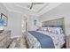 Bright bedroom with trey ceilings, shuttered windows, coastal decor and an ensuite bath at 262 Sapphire Lake Dr # 202, Bradenton, FL 34209