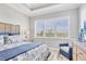 Bright bedroom with trey ceilings, shuttered windows and coastal decor and furnishings at 262 Sapphire Lake Dr # 202, Bradenton, FL 34209