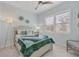 Bright bedroom with coastal decor, shuttered windows and an accent wall in a lovely beachy blue at 262 Sapphire Lake Dr # 202, Bradenton, FL 34209