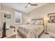 Comfortable bedroom with neutral walls, vaulted ceilings, shuttered windows and stylish decor at 262 Sapphire Lake Dr # 202, Bradenton, FL 34209