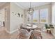 Bright breakfast nook with a round table, seating for four, and natural light from three windows at 262 Sapphire Lake Dr # 202, Bradenton, FL 34209