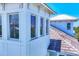 This is an exterior view of a two-story home with a white siding and a tile roof at 262 Sapphire Lake Dr # 202, Bradenton, FL 34209