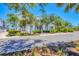 Charming two-story home with a well-manicured front yard and inviting porch on a sunny day at 262 Sapphire Lake Dr # 202, Bradenton, FL 34209