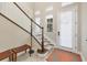 Bright foyer with soaring ceilings, stylish staircase, tile flooring, and a welcoming entryway at 262 Sapphire Lake Dr # 202, Bradenton, FL 34209