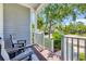 Cozy front porch with comfortable seating, offering a relaxing view of the landscaped surroundings at 262 Sapphire Lake Dr # 202, Bradenton, FL 34209