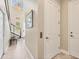 Hallway with tile floors, stairway, and a convenient elevator for accessibility and ease at 262 Sapphire Lake Dr # 202, Bradenton, FL 34209