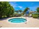 Inviting community hot tub area with lush greenery, comfortable lounge chairs, and a tranquil atmosphere at 262 Sapphire Lake Dr # 202, Bradenton, FL 34209