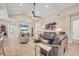 Open living area with comfortable seating, a modern ceiling fan, and tiled flooring at 262 Sapphire Lake Dr # 202, Bradenton, FL 34209
