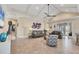 Open living area with tiled floors, a ceiling fan, and plenty of natural light at 262 Sapphire Lake Dr # 202, Bradenton, FL 34209