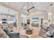 An open concept living area looks into the modern kitchen with stainless steel appliances and an island at 262 Sapphire Lake Dr # 202, Bradenton, FL 34209