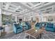 Bright lounge area with stylish furniture, elegant ceiling design, and scenic views, ideal for relaxation and socializing at 262 Sapphire Lake Dr # 202, Bradenton, FL 34209