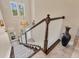 View from the top of the staircase looking down into the bright foyer of the home at 262 Sapphire Lake Dr # 202, Bradenton, FL 34209