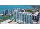 An eye-level view shows the condo complex, offering beautiful views of the waterways and cityscape at 301 Quay Commons # 1208, Sarasota, FL 34236