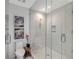 Bright bathroom featuring glass shower, toilet, and decorative accents at 301 Quay Commons # 1208, Sarasota, FL 34236