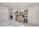 Bedroom features modern decor, shelving, and en-suite bathroom access at 301 Quay Commons # 1208, Sarasota, FL 34236