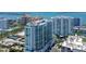 Aerial view of the luxury high-rise featuring stunning architecture and water views at 301 Quay Commons # 1208, Sarasota, FL 34236