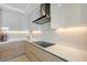 Sleek, modern kitchen with stainless steel appliances and quartz countertops at 301 Quay Commons # 1208, Sarasota, FL 34236