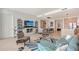 Cozy living room with a large TV, stylish decor, and an open layout at 301 Quay Commons # 1208, Sarasota, FL 34236