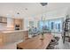 Spacious living area with modern kitchen, living, and dining spaces, and city views at 301 Quay Commons # 1208, Sarasota, FL 34236