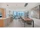 Bright, open-concept living space with a view of the city skyline and modern decor at 301 Quay Commons # 1208, Sarasota, FL 34236