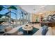 Bright lobby area features comfortable seating, modern decor, and large windows with city views at 301 Quay Commons # 1208, Sarasota, FL 34236