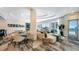 Bright lobby has modern lighting, large windows, comfortable seating, and an 'exit' sign at 301 Quay Commons # 1208, Sarasota, FL 34236