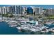 Bustling marina filled with luxurious yachts and stunning waterfront views of the city at 301 Quay Commons # 1208, Sarasota, FL 34236