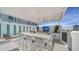 Residents can enjoy this outdoor kitchen area with seating at 301 Quay Commons # 1208, Sarasota, FL 34236