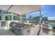 An outdoor kitchen space featuring stainless steel grills for resident cookouts and entertaining at 301 Quay Commons # 1208, Sarasota, FL 34236