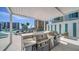 Modern outdoor kitchen with stainless steel appliances overlooking the city and poolside lounge at 301 Quay Commons # 1208, Sarasota, FL 34236