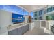 This outdoor kitchen area provides residents with a place to grill out at 301 Quay Commons # 1208, Sarasota, FL 34236