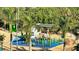 Close-up of community playground with a bird sculpture and creative play elements at 301 Quay Commons # 1208, Sarasota, FL 34236
