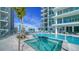 Enjoy a relaxing day with this outdoor pool and lounging area at 301 Quay Commons # 1208, Sarasota, FL 34236