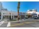 Charming storefronts along a city street with pedestrian walkways at 301 Quay Commons # 1208, Sarasota, FL 34236