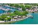 Waterfront tiki bar and restaurant by the water, lined with palm trees at 301 Quay Commons # 1208, Sarasota, FL 34236