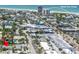 Aerial view showcases Siesta Key Village's vibrant cityscape, beach and waterfront at 310 Avenida Milano, Sarasota, FL 34242