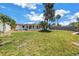 Expansive backyard offering ample space for gardening and relaxation, complemented by lush green grass at 310 Avenida Milano, Sarasota, FL 34242