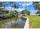 View of a shady canal and palm trees at 310 Avenida Milano, Sarasota, FL 34242