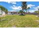 Expansive backyard offering ample space for gardening and relaxation, complemented by lush green grass at 310 Avenida Milano, Sarasota, FL 34242