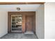 Close up front entry with front door and adjacent window to the left at 310 Avenida Milano, Sarasota, FL 34242