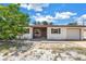 Charming single-story home features a one-car garage and a simple front landscape at 310 Avenida Milano, Sarasota, FL 34242