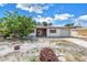Charming single-story home features a one-car garage, and simple front landscape at 310 Avenida Milano, Sarasota, FL 34242