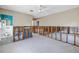 Large living room with access to the bathroom, with ample natural light and potential for renovation and customization at 310 Avenida Milano, Sarasota, FL 34242