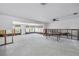 Large living room with generous space and ample natural light from numerous windows, awaiting personalization at 310 Avenida Milano, Sarasota, FL 34242
