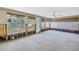 Light-filled sunroom featuring numerous windows, offering a versatile space for relaxation and entertainment, ready to renovate at 310 Avenida Milano, Sarasota, FL 34242