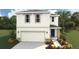 Two-story home featuring a two-car garage, landscaped yard and a welcoming front entryway at 3215 Bitterroot Ln, Lakewood Ranch, FL 34211